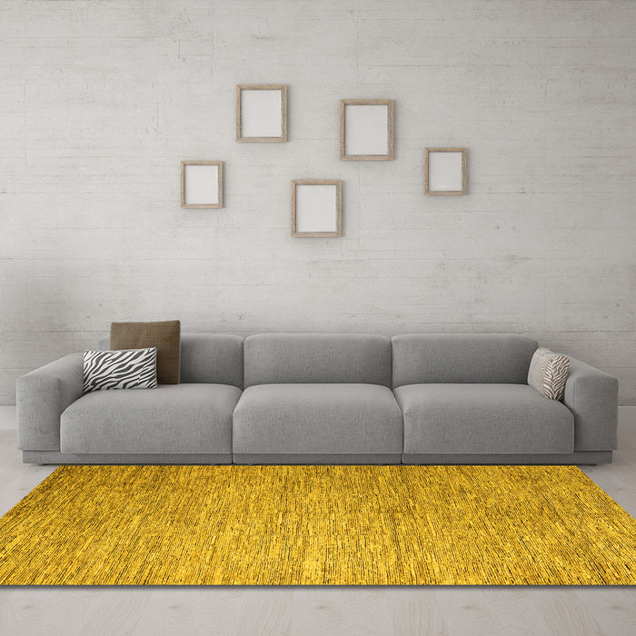 Machine Washable Solid Yellow Modern Rug in a Living Room, wshabs4705yw