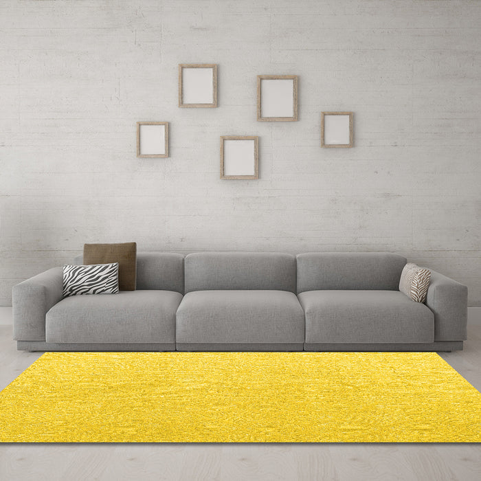 Machine Washable Solid Yellow Modern Rug in a Living Room, wshabs4910yw