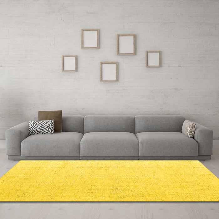 Machine Washable Solid Yellow Modern Rug in a Living Room, wshabs5004yw
