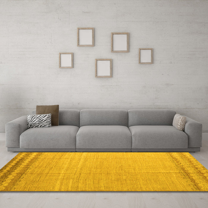 Machine Washable Solid Yellow Modern Rug in a Living Room, wshabs5050yw