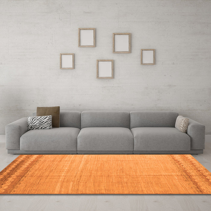 Machine Washable Solid Orange Modern Area Rugs in a Living Room, wshabs5050org