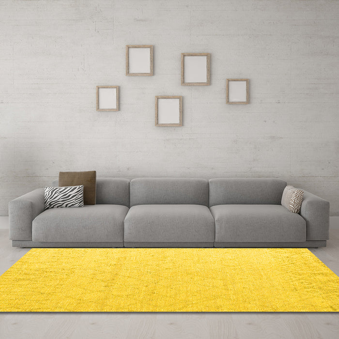 Machine Washable Solid Yellow Modern Rug in a Living Room, wshabs5072yw