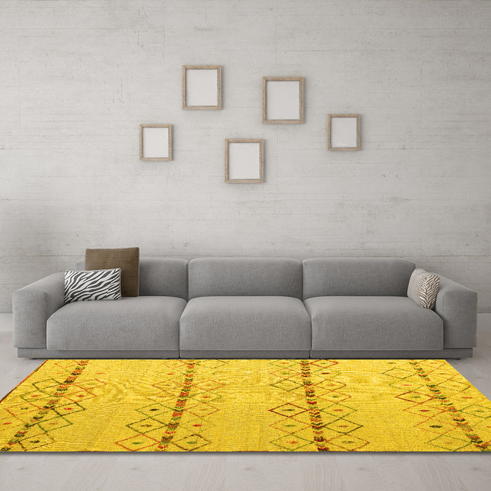 Machine Washable Solid Yellow Modern Rug in a Living Room, wshabs5074yw