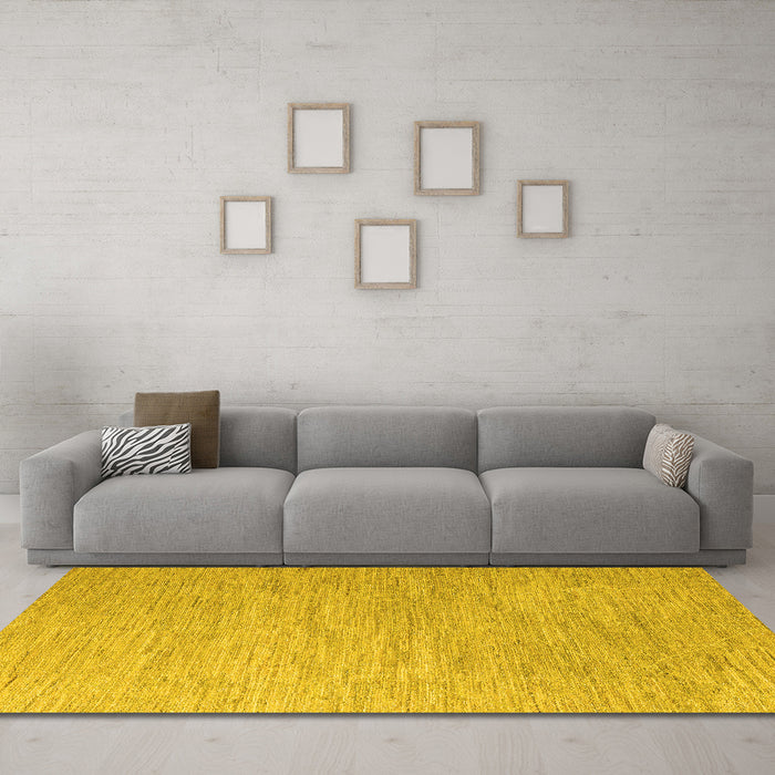 Machine Washable Solid Yellow Modern Rug in a Living Room, wshabs5079yw