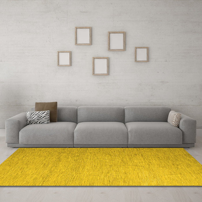 Machine Washable Solid Yellow Modern Rug in a Living Room, wshabs5145yw