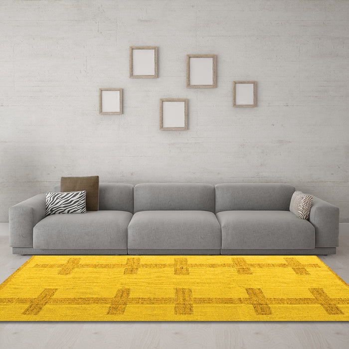 Machine Washable Solid Yellow Modern Rug in a Living Room, wshabs5221yw