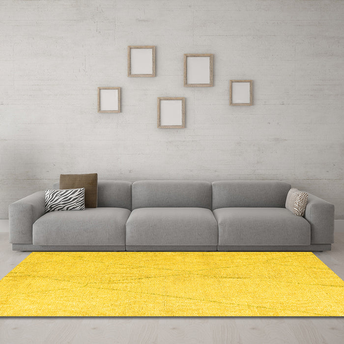 Machine Washable Solid Yellow Modern Rug in a Living Room, wshabs5245yw