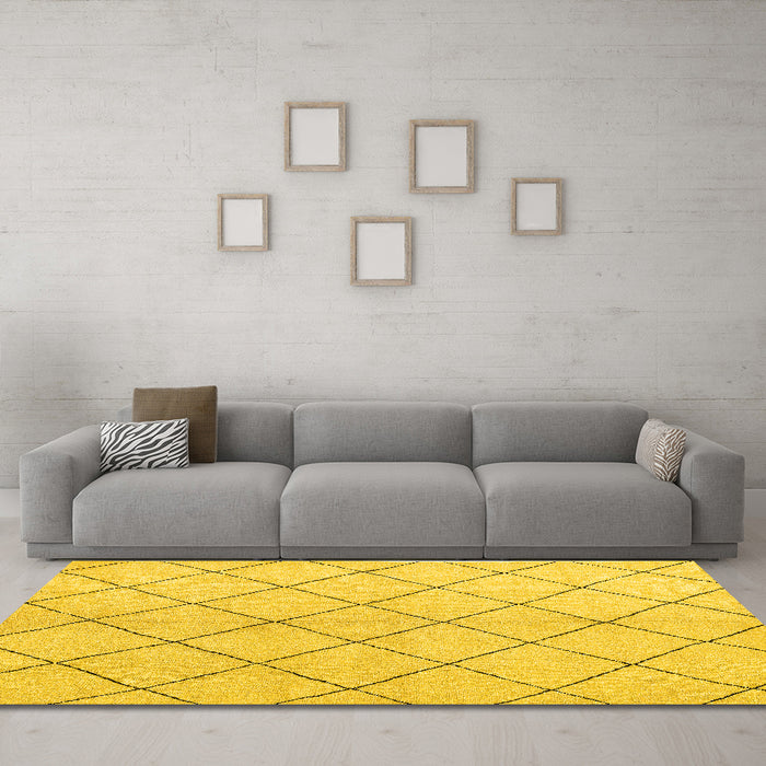 Machine Washable Solid Yellow Modern Rug in a Living Room, wshabs5246yw