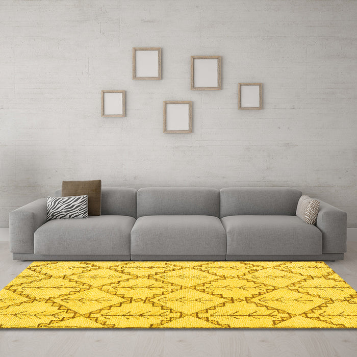 Machine Washable Solid Yellow Modern Rug in a Living Room, wshabs5274yw