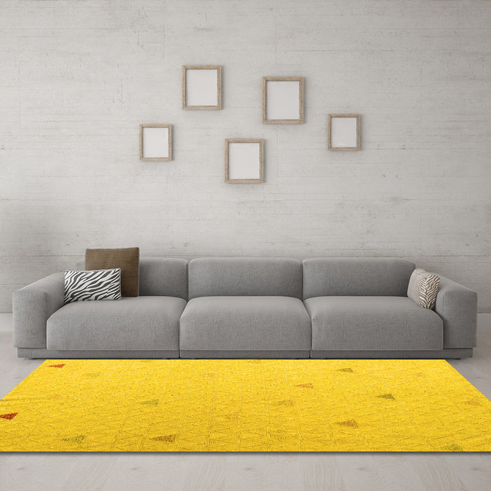 Machine Washable Solid Yellow Modern Rug in a Living Room, wshabs5367yw