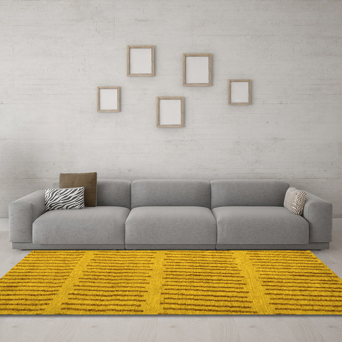 Machine Washable Solid Yellow Modern Rug in a Living Room, wshabs5440yw
