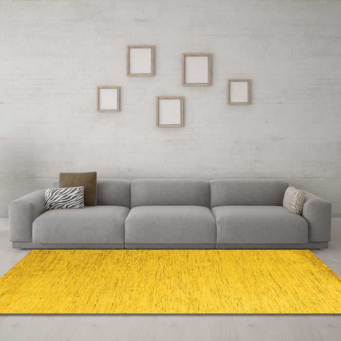 Machine Washable Solid Yellow Modern Rug in a Living Room, wshabs5552yw
