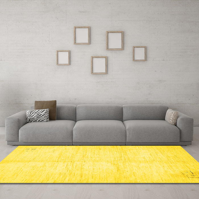 Machine Washable Solid Yellow Modern Rug in a Living Room, wshabs5594yw
