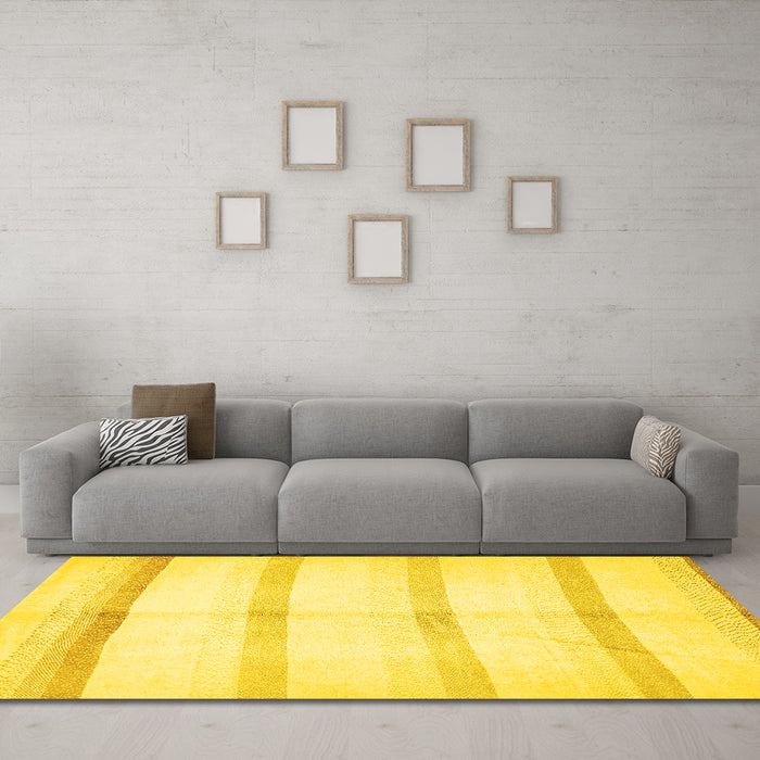 Machine Washable Solid Yellow Modern Rug in a Living Room, wshabs5595yw