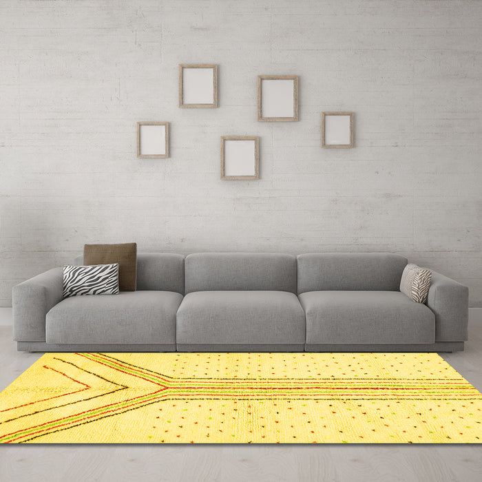 Machine Washable Solid Yellow Modern Rug in a Living Room, wshabs670yw