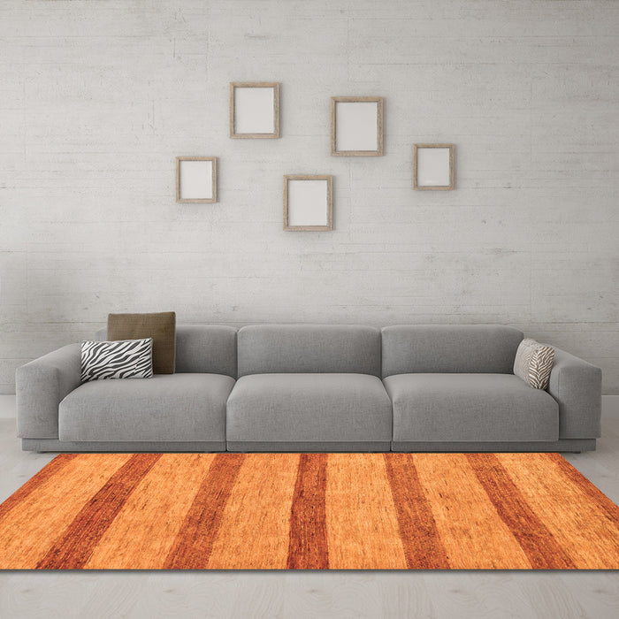 Machine Washable Abstract Orange Modern Area Rugs in a Living Room, wshabs99org