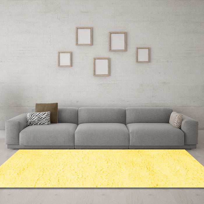 Machine Washable Solid Yellow Modern Rug in a Living Room, wshcon1025yw