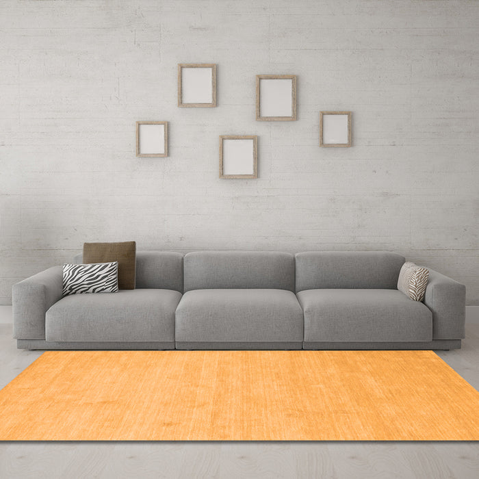 Machine Washable Solid Orange Modern Area Rugs in a Living Room, wshcon1026org