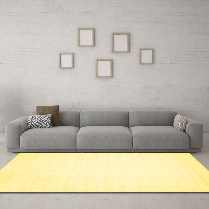 Machine Washable Solid Yellow Modern Rug in a Living Room, wshcon103yw