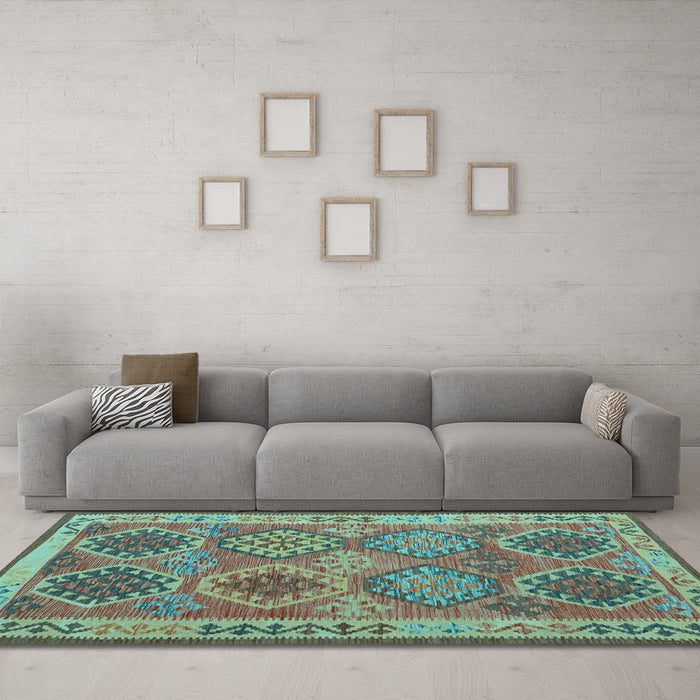 Machine Washable Oriental Light Blue Traditional Rug in a Living Room, wshcon1102lblu