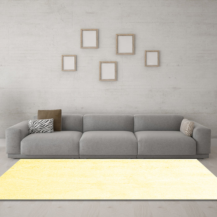 Machine Washable Solid Yellow Modern Rug in a Living Room, wshcon1104yw