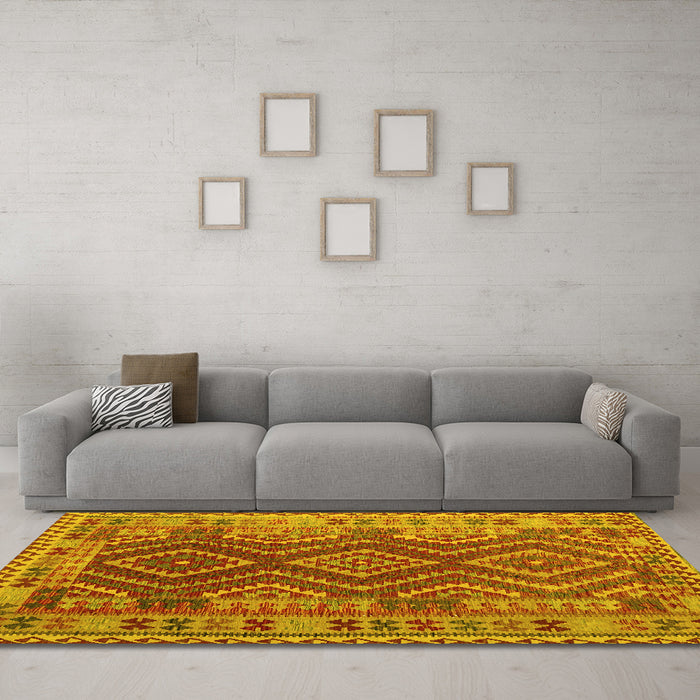 Machine Washable Oriental Yellow Traditional Rug in a Living Room, wshcon1117yw