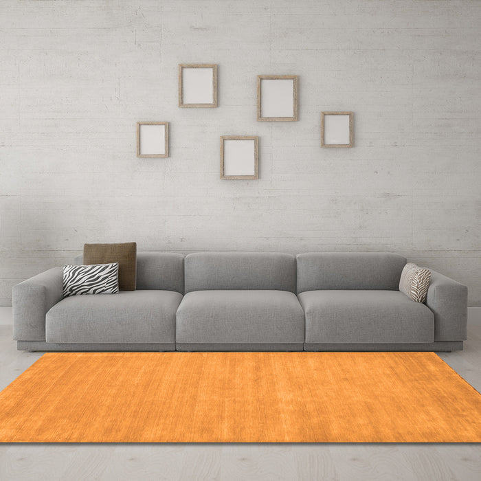 Machine Washable Solid Orange Modern Area Rugs in a Living Room, wshcon112org