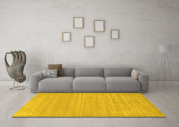 Machine Washable Solid Yellow Modern Rug in a Living Room, wshcon113yw