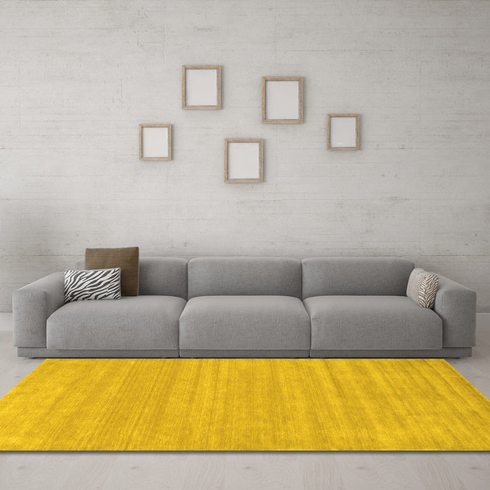 Machine Washable Solid Yellow Modern Rug in a Living Room, wshcon113yw