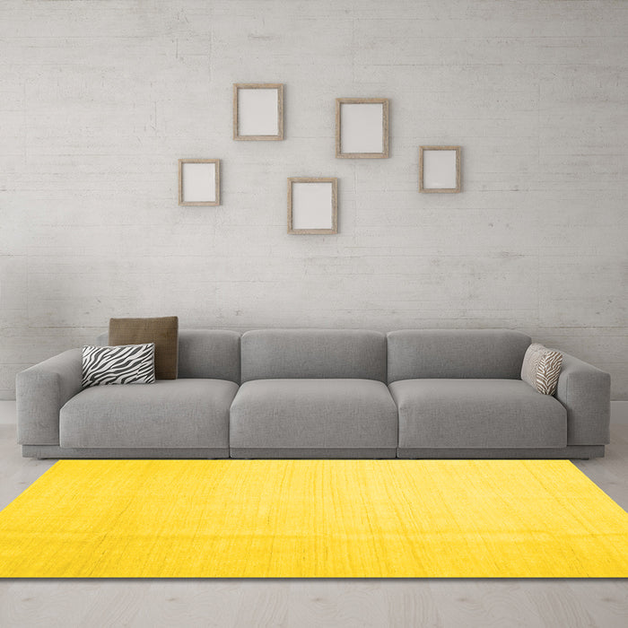 Machine Washable Solid Yellow Modern Rug in a Living Room, wshcon1140yw