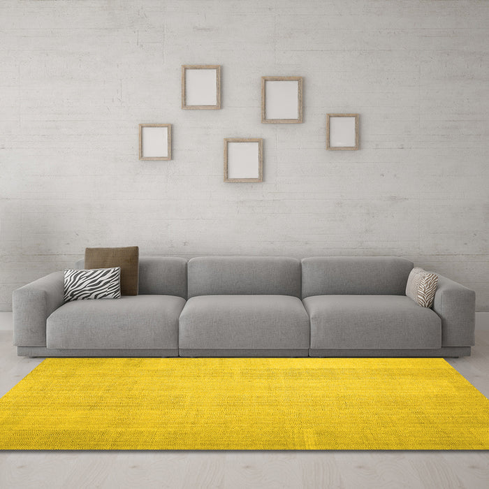 Machine Washable Solid Yellow Modern Rug in a Living Room, wshcon1158yw