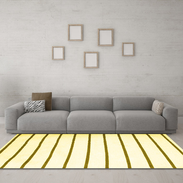 Machine Washable Solid Yellow Modern Rug in a Living Room, wshcon1179yw