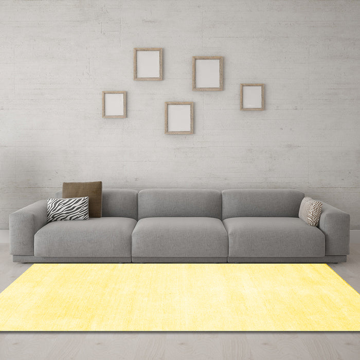 Machine Washable Solid Yellow Modern Rug in a Living Room, wshcon117yw