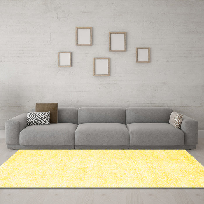 Machine Washable Solid Yellow Modern Rug in a Living Room, wshcon124yw
