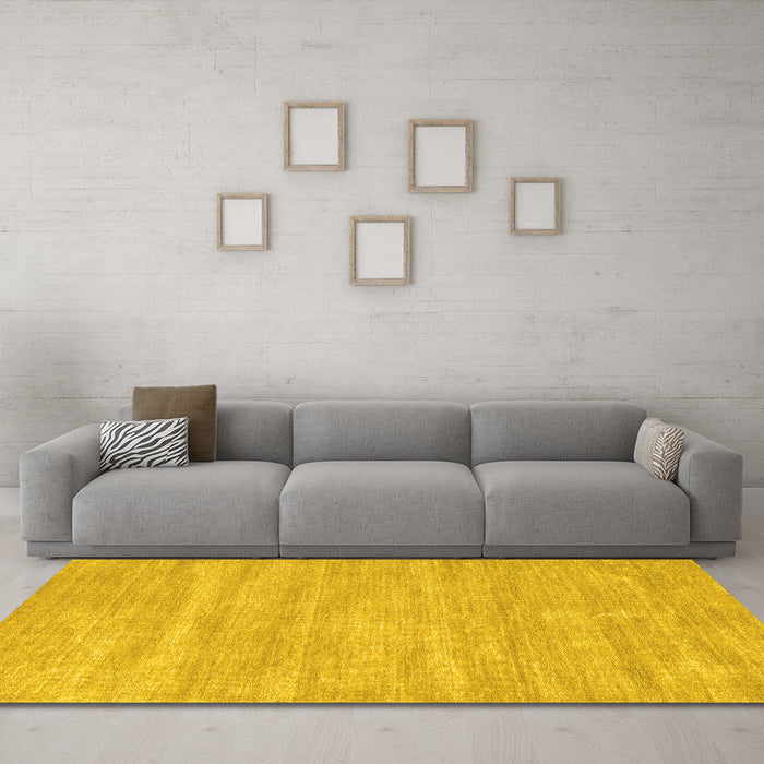 Machine Washable Solid Yellow Modern Rug in a Living Room, wshcon125yw