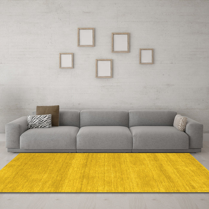 Machine Washable Solid Yellow Modern Rug in a Living Room, wshcon128yw