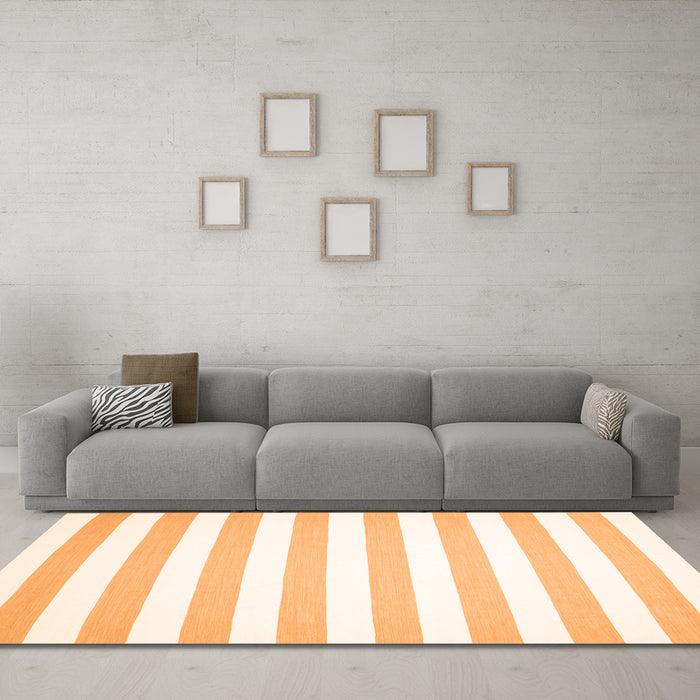Machine Washable Solid Orange Modern Area Rugs in a Living Room, wshcon12org