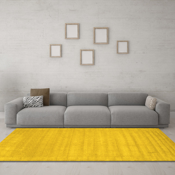 Machine Washable Solid Yellow Modern Rug in a Living Room, wshcon131yw