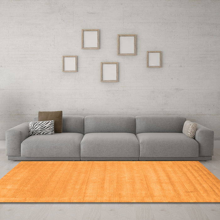 Machine Washable Solid Orange Modern Area Rugs in a Living Room, wshcon131org