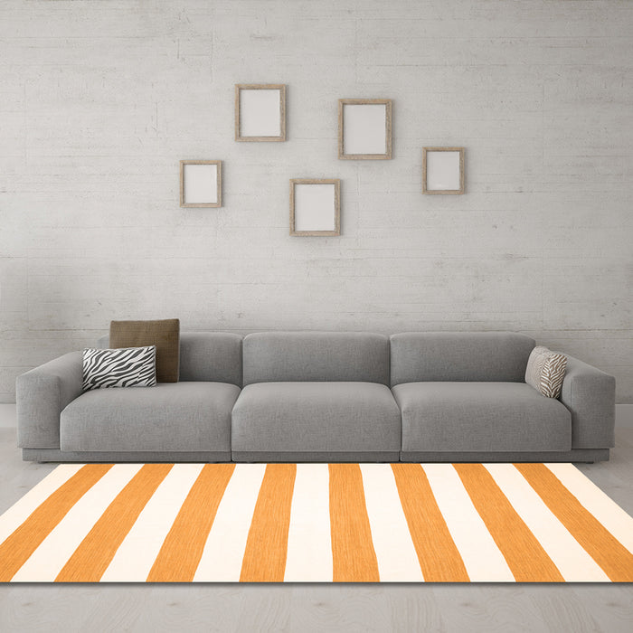 Machine Washable Solid Orange Modern Area Rugs in a Living Room, wshcon13org