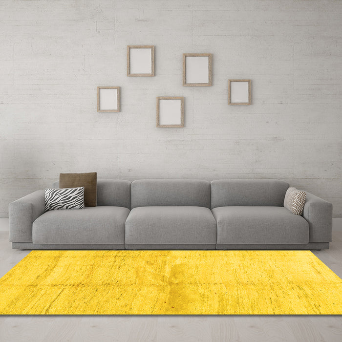 Machine Washable Solid Yellow Modern Rug in a Living Room, wshcon1403yw