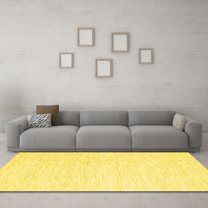 Machine Washable Solid Yellow Modern Rug in a Living Room, wshcon1435yw