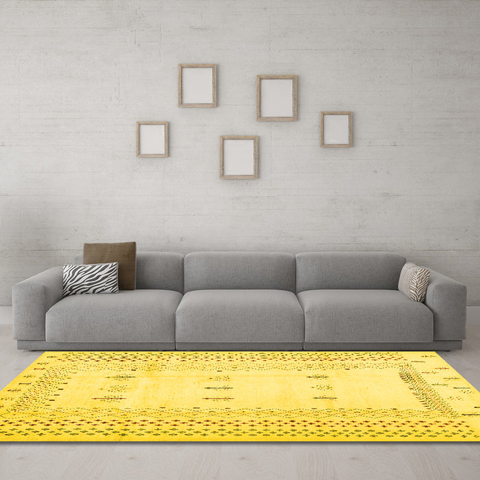 Machine Washable Solid Yellow Modern Rug in a Living Room, wshcon1516yw