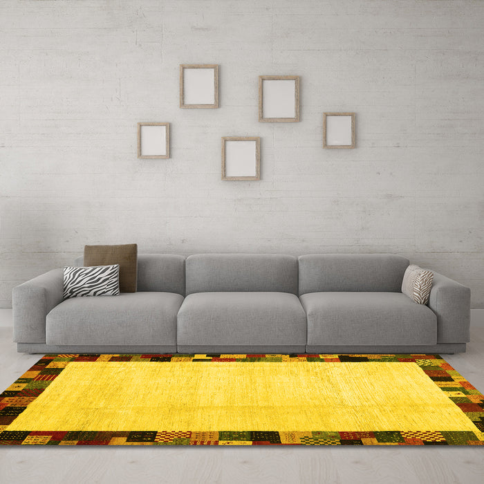 Machine Washable Solid Yellow Modern Rug in a Living Room, wshcon1540yw