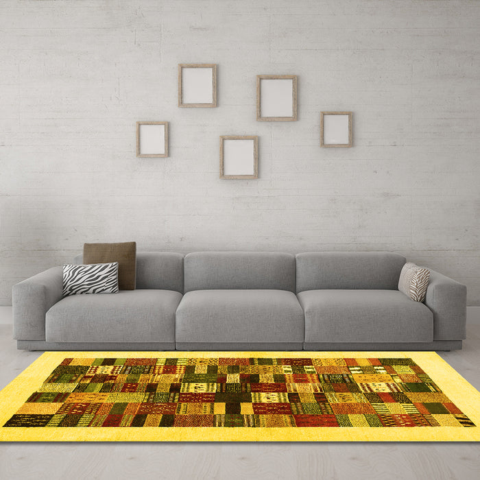 Machine Washable Solid Yellow Modern Rug in a Living Room, wshcon1593yw