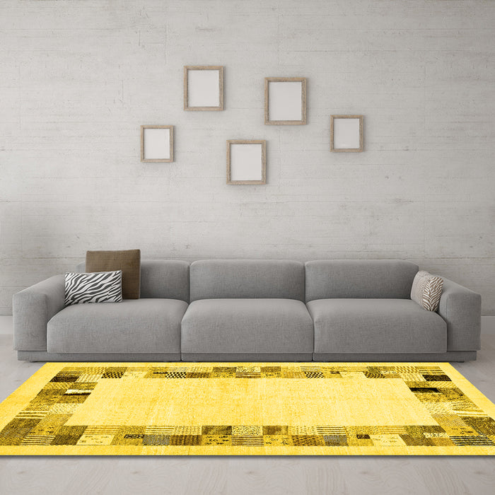 Machine Washable Solid Yellow Modern Rug in a Living Room, wshcon1613yw