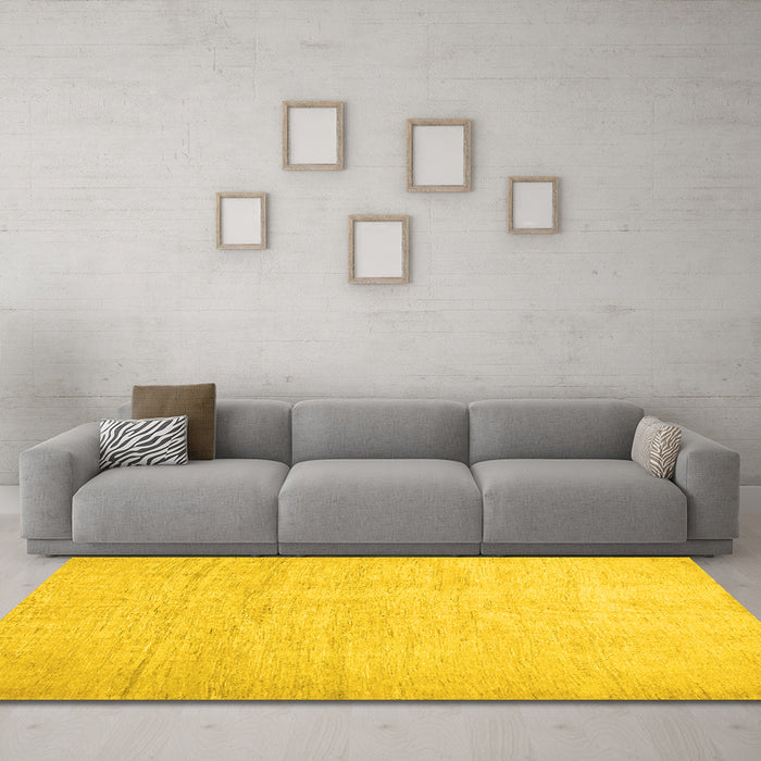 Machine Washable Solid Yellow Modern Rug in a Living Room, wshcon1631yw
