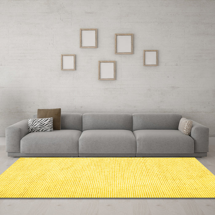 Machine Washable Solid Yellow Modern Rug in a Living Room, wshcon1747yw