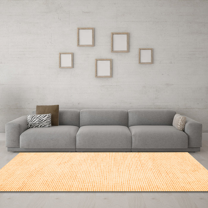 Machine Washable Solid Orange Modern Area Rugs in a Living Room, wshcon1747org
