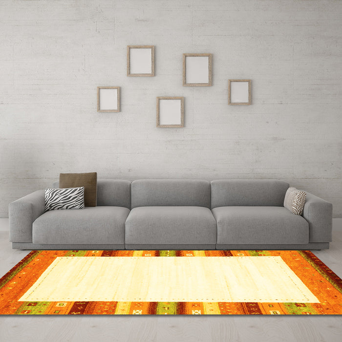 Machine Washable Solid Yellow Modern Rug in a Living Room, wshcon1772yw